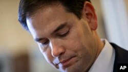 U.S. Senator Marco Rubio, a Florida Republican and son of Cuban immigrants, prepares for a Washington news conference in which he expresses disapproval of a plan to normalize relations with the island nation, Dec. 17, 2014.