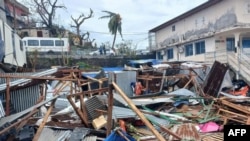 This photograph shows a pile of debris of metal sheets and wood after the cyclone Chido hit France's Indian Ocean territory of Mayotte, on Dec. 14, 2024 in the capital Mamoudzou.