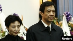 China's former Chongqing Municipality Communist Party Secretary Bo Xilai (R) and his wife Gu Kailai.