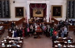 FILE - Texas state Rep. Donna Howard, D-Austin, center at lectern, opposes a bill introduced that would ban abortions as early as six weeks, in the House Chamber in Austin, Texas, May 5, 2021.