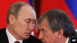 Володимир Путін та Ігор Сечін, голова Роснафти