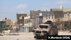 A burnt-out vehicle is left behind after a recent battle in a once-crowded suburb of Tripoli, Libya, April 28, 2019.
