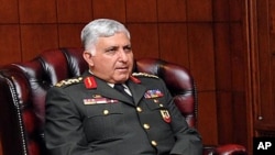 General Necdet Ozel, the commander of the paramilitary police, meets with Turkey's President Abdullah Gul (unseen) at the Presidential Palace of Cankaya in Ankara, July 29, 2011