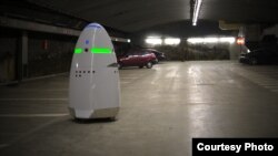 This photo from California manufacturer Knightscope shows the company's K5 security robot, keeping tabs on a parking area.