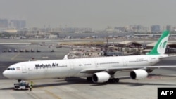 FILE - A picture taken on September 14, 2017, shows an Airbus A340 of Mahan Air at the tarmac at Dubai's International Airport.