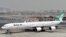 FILE - A picture taken on September 14, 2017, shows an Airbus A340 of Mahan Air at the tarmac at Dubai's International Airport.
