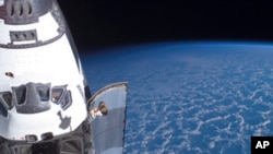 The Space Shuttle Endeavour is docked to the International Space Station during its final mission to space.