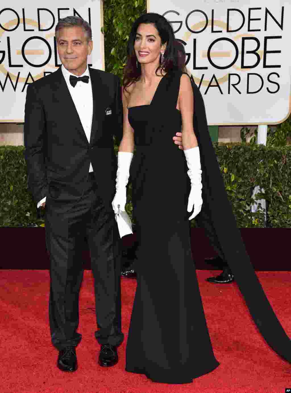 George and Amal Clooney arrive at the 72nd annual Golden Globe Awards. George Clooney was honored with the Cecil B. DeMille Award for lifetime achievement, at the Beverly Hilton Hotel,&nbsp;in Beverly Hills, California, Jan. 11, 2015.
