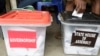 FILE - A man casts a ballot in Lagos, Nigeria, April 11, 2015. 