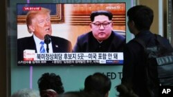 FILE - People watch a TV screen showing file footage of U.S. President Donald Trump, left, and North Korean leader Kim Jong Un during a news program at the Seoul Railway Station, in Seoul, South Korea, April 18, 2018.
