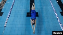Palestinian swimmer Mary Al-Atrash, 22, who will represent Palestine at the 2016 Rio Olympics, trains in a swimming pool in Beit Sahour, near the West Bank town of Bethlehem, June 27, 2016.