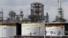 FILE - Storage tanks are seen at an oil refinery in Detroit, Michigan, April 21, 2020.