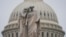 The U.S. Capitol Dome is seen behind the Peace Monument statue in Washington, Monday, Dec. 31, 2018, as a partial government shutdown stretches into its second week.