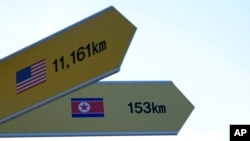 Destination signs to North Korea's capital, Pyongyang, and the United States are seen at the Imjingak Pavilion in Paju, near the border with North Korea, South Korea, Jan. 14, 2022.