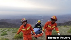 Rescue workers work at the site of the accident where extreme cold weather killed participants of an 100-km ultramarathon race in Baiyin, May 23, 2021.