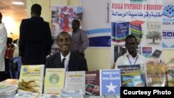 Participants are seen behind a display at the Mogadishu Book Fair in Mogadishu, Somalia. (Courtesy - Mogadishu Book Fair)