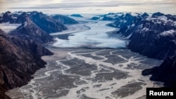 FILE - The melting Sermeq glacier, located around 80 km south of Nuuk, is photographed in this aerial over Greenland, Sept. 11, 2021. 