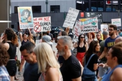 FILE - Anti-vaccine protesters confront people as they queue to enter a concert which requires proof of vaccination to enter, at the Madison Square Garden, in New York City, June 20, 2021.
