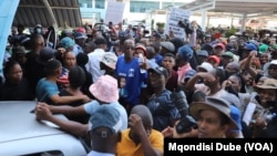 Scores of people march amid concerns about corruption in state enterprises, in Gaborone, Botswana, Nov 18, 2024. 