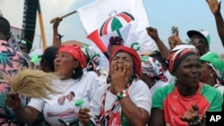 FILE - Supporters of the former Ghana President and presidential candidate for the National Democratic Congress (NDC), John Mahama, gather during the party's final rally, in Accra, Dec. 5, 2024,