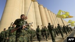 Syrian fighters attend their graduation ceremony near Syria's northeastern city of Hasakah, Jan. 20, 2018.
