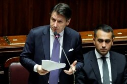 FILE - Italian Prime Minister Giuseppe Conte presents his government's program as 5-Star Movement leader Luigi di Maio sits next to him, ahead of confidence vote at the Parliament in Rome, Sept. 9, 2019.