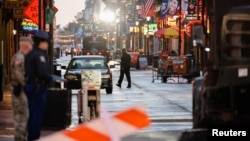Law enforcement officers work at the site where people were killed by a man driving a truck in an attack during New Year's celebrations in New Orleans, Louisiana, on Jan. 2, 2025.