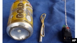 This undated image made available in the Islamic State's English-language magazine Dabiq, Wednesday, Nov. 18, 2015, claims to show the bomb that was used to blow up a Metrojet passenger plane bound for St. Petersburg, Russia, that crashed in Hassana, north Sinai, Egypt, killing all 224 people on board. 