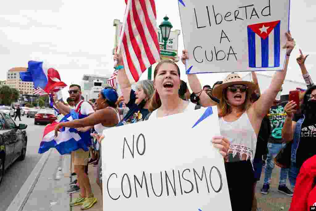Cuban exiles rally at Versailles Restaurant in Miami's Little Havana neighborhood in support of protesters in Cuba, July 12, 2021, in Miami. 