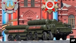 FILE - Russian S-400 air defense missile systems are on display during a rehearsal for the Victory Day military parade in Red Square in Moscow, Russia, May 7, 2017. 