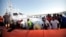 Migrants prepare to disembark in the island of Lampedusa, Italy, Aug. 7, 2013, after being rescued at sea by the Italian Coast Guard. 