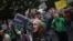 Protesters shout slogans during a demonstration against cuts in public education, in central Madrid, September 27, 2012.