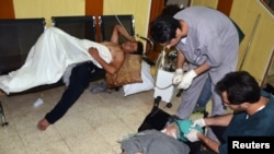 People, affected by what activists say is nerve gas, are treated at a hospital in the Duma neighborhood of Damascus August 21, 2013. 