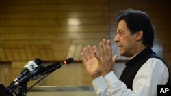 Pakistani Prime Minister Imran Khan addresses Kashmir's Legislative Assembly on the occasion of Pakistan's Independence Day, in Muzaffarabad, capital of Pakistani Kashmir, Aug. 14, 2019. 