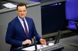 FILE - German Health Minister Jens Spahn speaks at the lower house of parliament Bundestag on the start of the coronavirus vaccinations, in Berlin, Germany, Jan. 13, 2021.