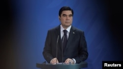 FILE - President of Turkmenistan Kurbanguly Berdymukhamedov attends a news conference in Berlin, Germany, Aug. 29, 2016.