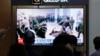 FILE - A TV screen at Seoul Railway Station in South Korea, on Oct. 21, 2024, shows an image of soldiers believed to be from North Korea standing in line to receive supplies from Russia.