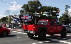 Supporters of U.S. President Donald Trump gather outside the Walter Reed National Military Medical Center in Bethesda, Maryland, October 5, 2020.