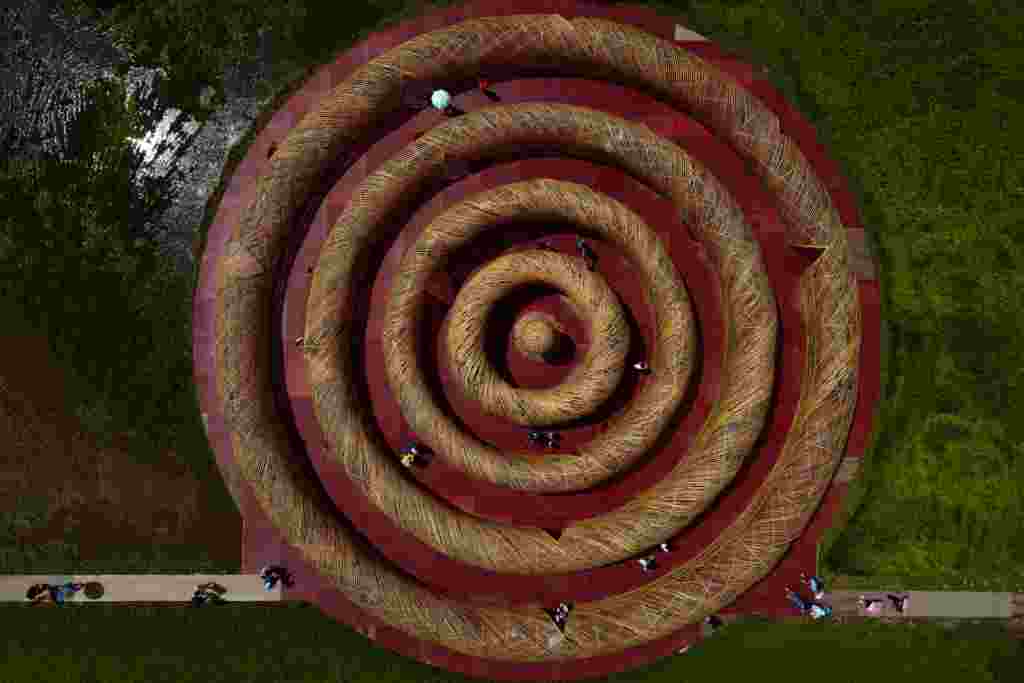 An aerial view shows tourists visiting an art installation 'The ripple maze at Gaoshuang' made of bamboo by Taiwanese artist Lee Kuei-chih during the Art Land Festivals in Taoyuan, Taiwan.