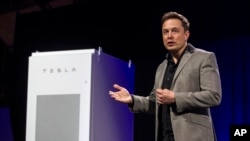 FILE - Elon Musk, CEO of Tesla Motors Inc., unveils the company’s newest products in Hawthorne, Calif., April 30, 2015. 