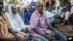FILE - Hissein Abakar, shown Aug. 28, 2014, in Boda, Central African Republic, said his 14-year-old son, Ali, was shot in the head, attacked with machetes and ultimately killed by Christian militia fighters.