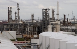 FILE - An oil refinery and storage facility is pictured south of downtown Houston, January 30, 2012.