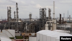 FILE - An oil refinery and storage facility is pictured south of downtown Houston, Jan. 30, 2012.