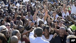 In this 7 Oct 2010 file photo, President Barack Obama greets people after speaking at a campaign rally for Maryland Gov. Martin O'Malley at Bowie State University in Bowie, Md.