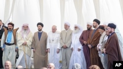 Pope Francis stands with religious leaders during an inter-faith meeting near the historic city of Ur, near Nasiriyah, Iraq, March 6, 2021. 