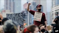 Protesters rally at the Barclays Center over the death of George Floyd, a black man who was in police custody in Minneapolis Friday, May 29, 2020, in the Brooklyn borough of New York.