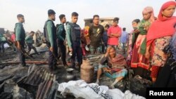 A man who lost his wife in a fire cries in Chittagong, Bangladesh February 17, 2019