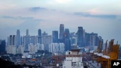 FILE - Singapore's financial skyline is seen, June 6, 2018, in Singapore.