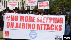 FILE - People with albinism march to the Malawi parliament in Lilongwe, Malawi, May 24, 2016. Africa's first-ever forum on albinism is set to being Friday in Tanzania. (L. Masina/VOA)