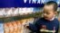 FILE - A Vietnamese boy looks at dairy products at a showroom of the Vietnam Dairy Products Co (Vinamilk) in Hanoi.
